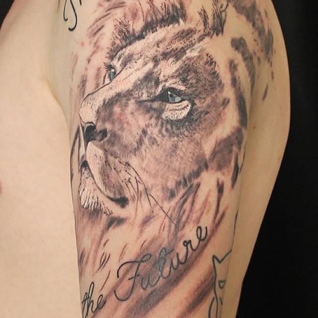 Lion tattoo on shoulder