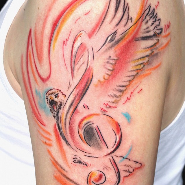 Eagle and treble clef tattoo